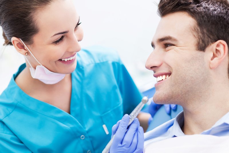 Dentist smiling at patient